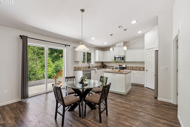 202 Edgewater Dr, Carson, WA 98610 - dining area with dark wood-style flooring, recessed lighting, and lofted ceiling