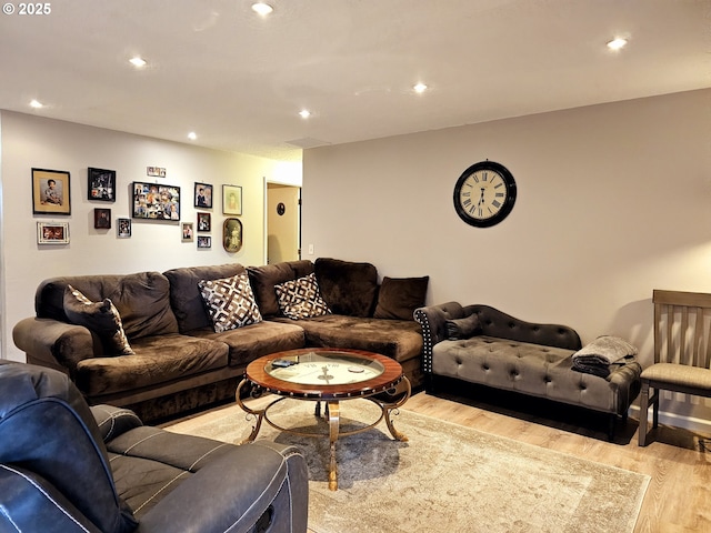 living area featuring recessed lighting and light wood-style flooring