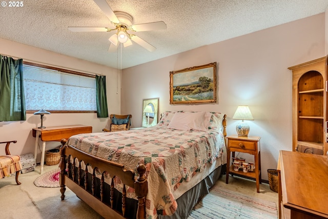 bedroom featuring ceiling fan and a textured ceiling