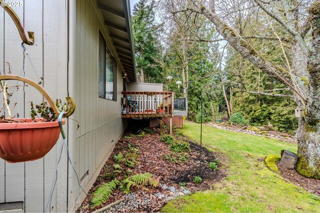 view of yard with a wooden deck