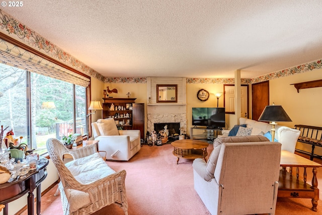 living area featuring carpet, a textured ceiling, and a high end fireplace