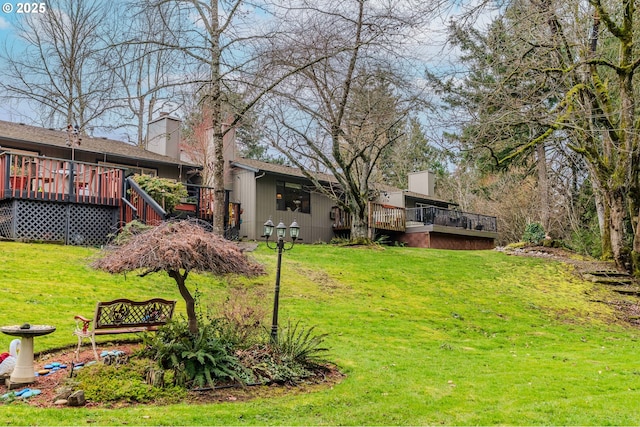 view of yard featuring a wooden deck