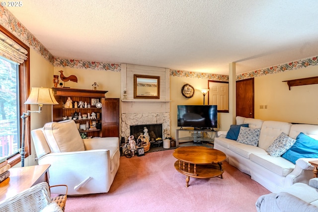 carpeted living room with a textured ceiling and a premium fireplace