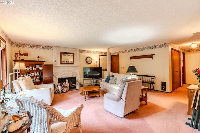 living room featuring a textured ceiling, a premium fireplace, and carpet flooring