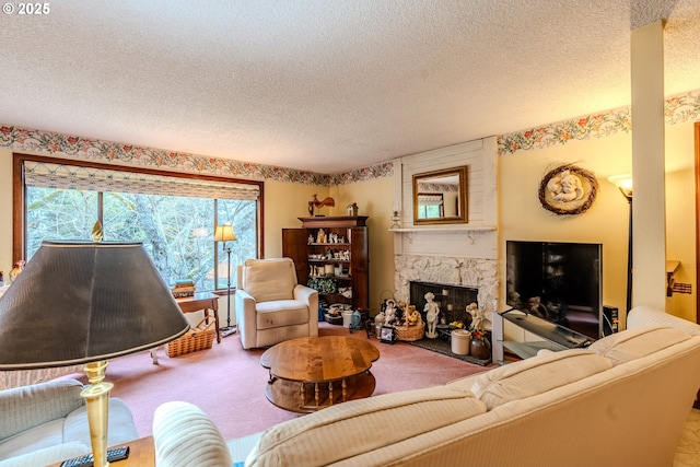 living area with a textured ceiling, carpet floors, and a premium fireplace