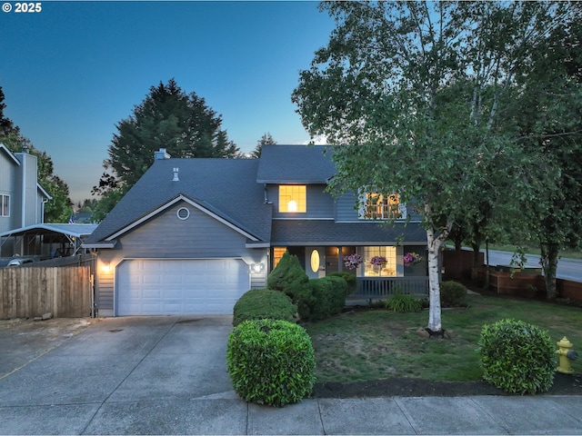 1404 NW 2nd Ave, Battle Ground, WA 98604 - view of front of home featuring a garage, concrete driveway, covered porch, and roof with shingles