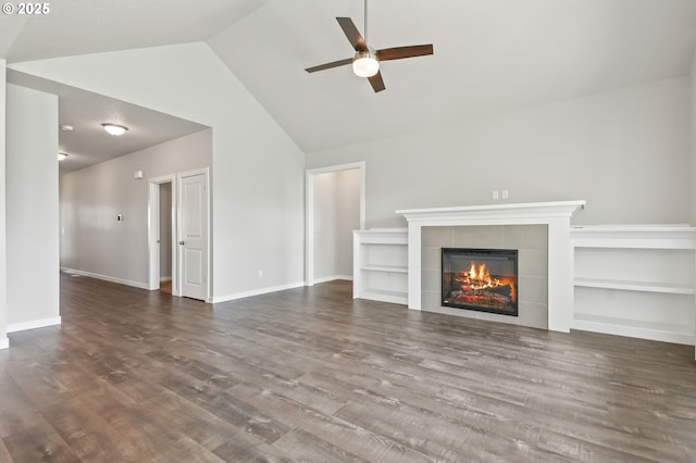 142 N 35th Pl, Cornelius, OR 97124 - unfurnished living room with ceiling fan, a fireplace, lofted ceiling, wood finished floors, and baseboards