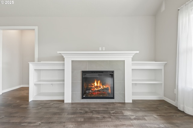 142 N 35th Pl, Cornelius, OR 97124 - detailed view of a tile fireplace, baseboards, and wood finished floors