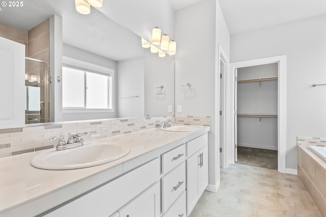 142 N 35th Pl, Cornelius, OR 97124 - full bath with double vanity, a stall shower, tasteful backsplash, a garden tub, and a spacious closet