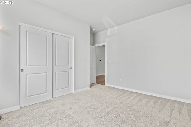 142 N 35th Pl, Cornelius, OR 97124 - unfurnished bedroom featuring carpet, baseboards, and a closet