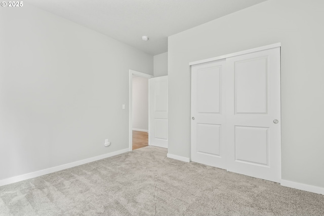 142 N 35th Pl, Cornelius, OR 97124 - unfurnished bedroom with carpet floors, a closet, and baseboards
