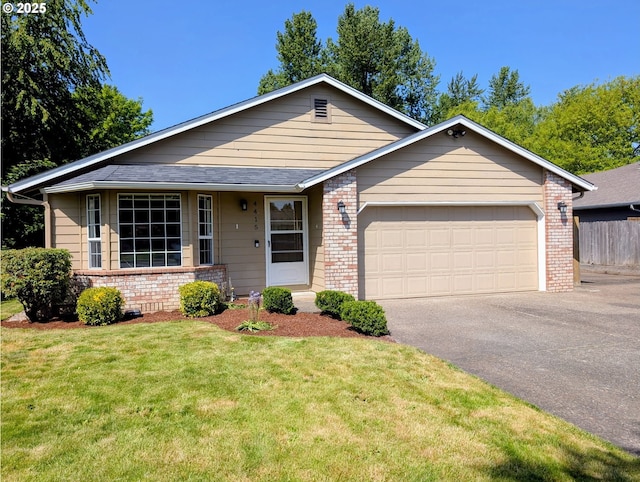 ranch-style house with a garage, aphalt driveway, fence, a front yard, and brick siding