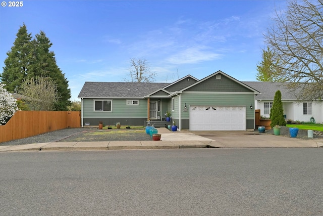 single story home featuring roof with shingles, an attached garage, fence, and driveway