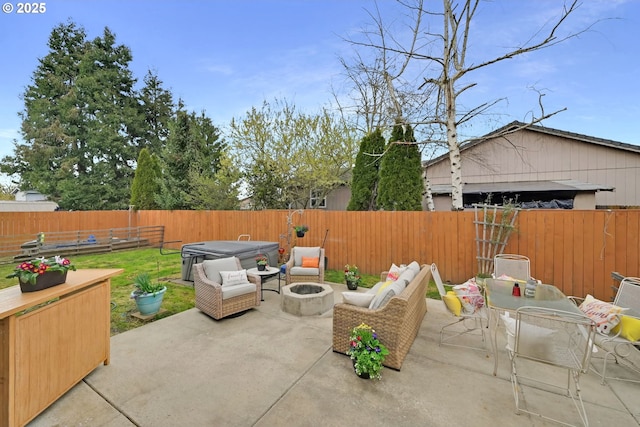 view of patio featuring a fenced backyard, an outdoor living space with a fire pit, and outdoor dining area