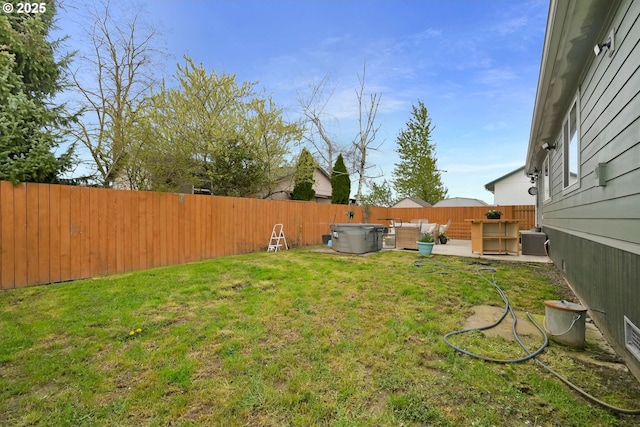 view of yard with a fenced backyard and a patio