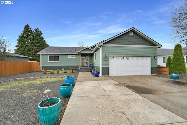 single story home featuring fence, driveway, and a garage