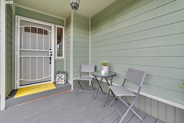 property entrance with a wooden deck
