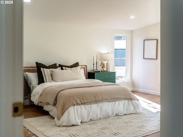 bedroom featuring recessed lighting, baseboards, and wood finished floors