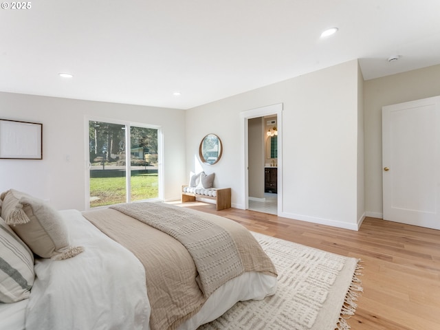 bedroom with baseboards, connected bathroom, light wood-style flooring, access to outside, and recessed lighting