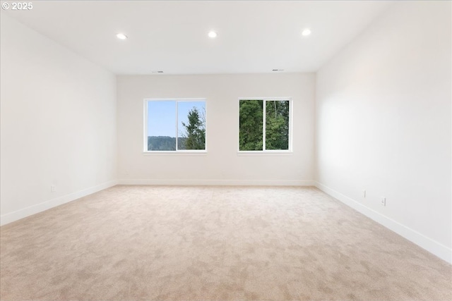 737 SE Forest Glen Rd, Estacada, OR 97023 - unfurnished living room with recessed lighting, visible vents, and light carpet