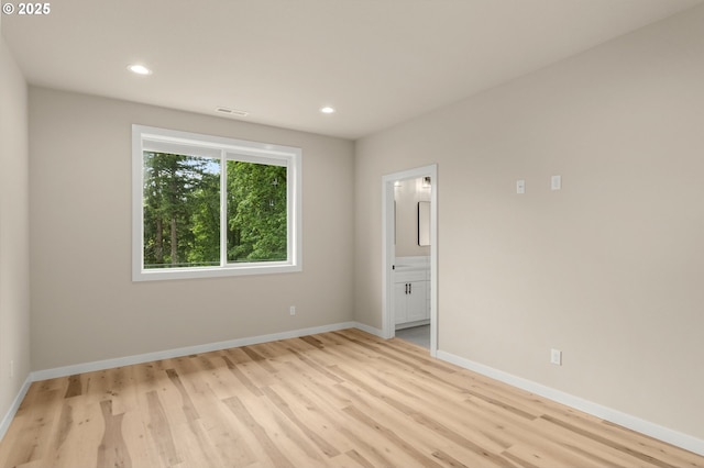 59787 Kimmell Ln, Saint Helens, OR 97051 - empty room with light wood finished floors, recessed lighting, and baseboards