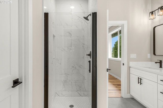 59787 Kimmell Ln, Saint Helens, OR 97051 - full bathroom featuring a marble finish shower, baseboards, and vanity