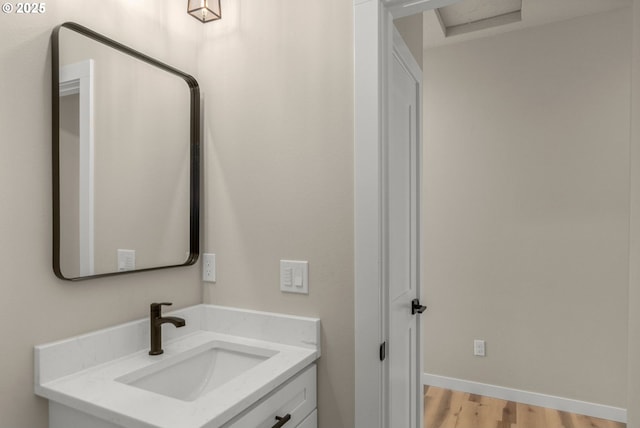 59787 Kimmell Ln, Saint Helens, OR 97051 - bathroom with wood finished floors, vanity, and baseboards