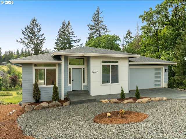 59787 Kimmell Ln, Saint Helens, OR 97051 - prairie-style house featuring concrete driveway, an attached garage, and a shingled roof