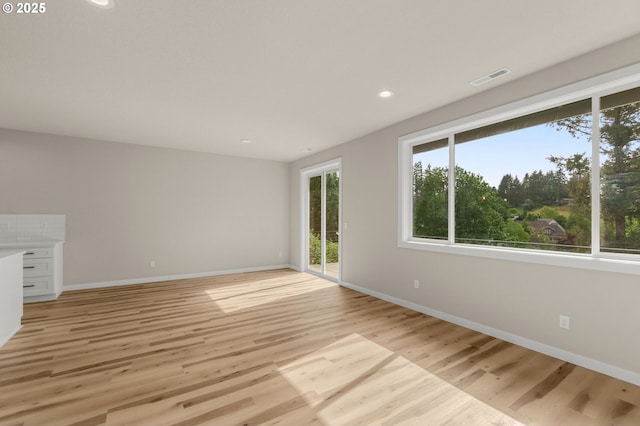 59787 Kimmell Ln, Saint Helens, OR 97051 - unfurnished living room with baseboards, light wood-type flooring, and recessed lighting