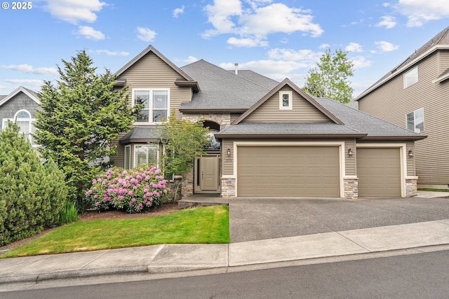 3578 NW Gerritz Ter, Portland, OR 97229 - view of front of property featuring stone siding, driveway, an attached garage, and a shingled roof