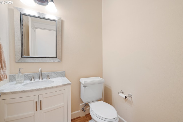 3578 NW Gerritz Ter, Portland, OR 97229 - bathroom with toilet, vanity, baseboards, and wood finished floors