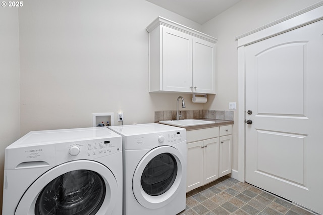 3578 NW Gerritz Ter, Portland, OR 97229 - washroom with cabinet space, separate washer and dryer, and stone finish flooring