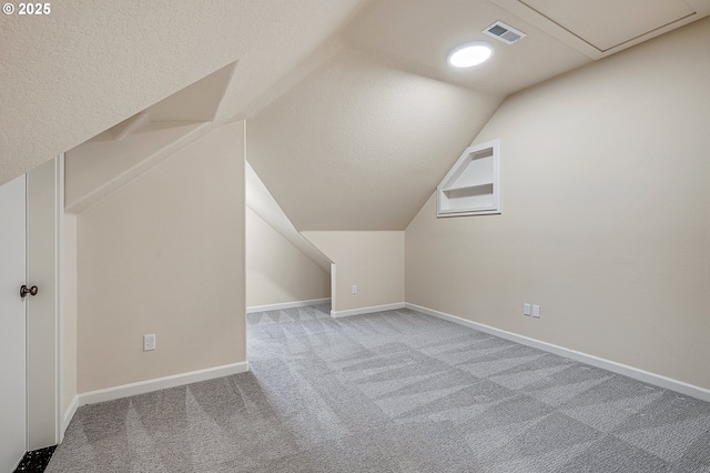 3578 NW Gerritz Ter, Portland, OR 97229 - bonus room featuring carpet floors, vaulted ceiling, baseboards, and attic access