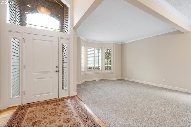 3578 NW Gerritz Ter, Portland, OR 97229 - foyer with crown molding, baseboards, and light carpet