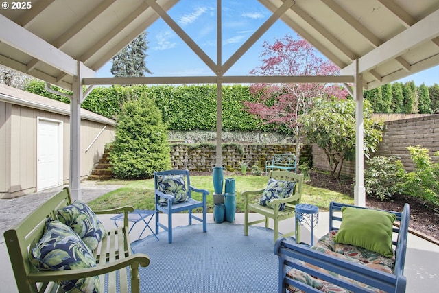 view of patio with fence and an outdoor living space