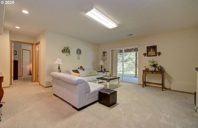 living area with light carpet, baseboards, and recessed lighting