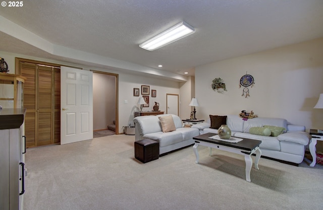living room with light colored carpet and recessed lighting