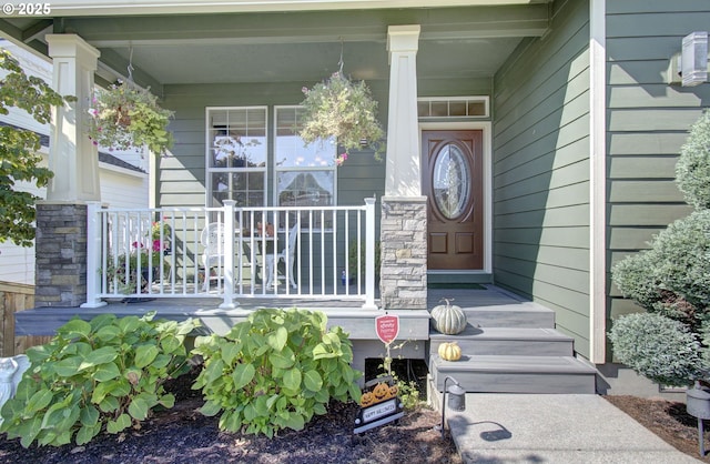 doorway to property featuring a porch