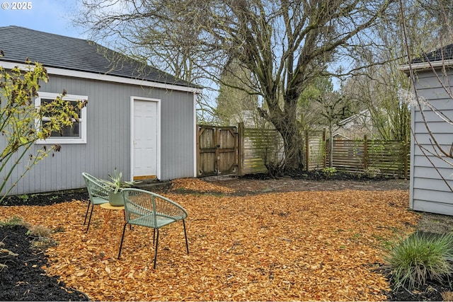 view of yard featuring a gate and fence