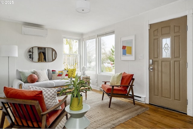 living area featuring a wall mounted air conditioner and wood finished floors