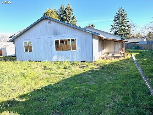 view of home's exterior with a yard