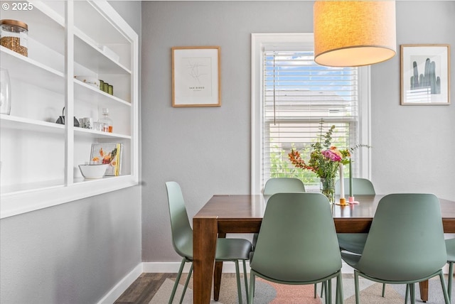 6955 N Concord Ave, Portland, OR 97217 - dining area with baseboards and wood finished floors