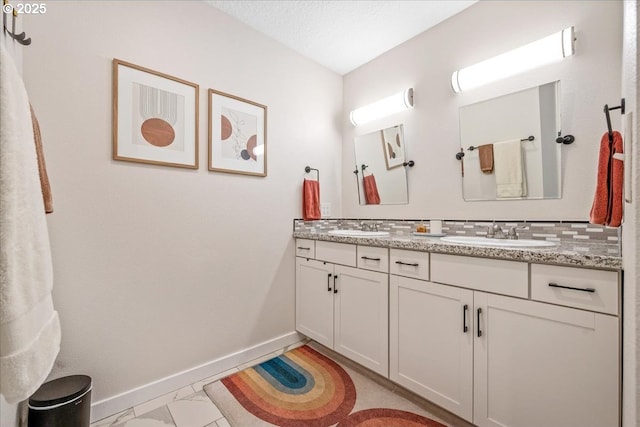 6955 N Concord Ave, Portland, OR 97217 - bathroom with double vanity and baseboards