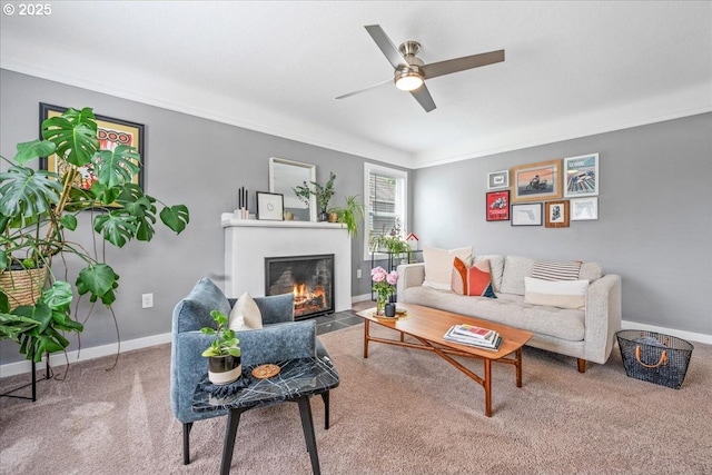 6955 N Concord Ave, Portland, OR 97217 - living area with a fireplace with flush hearth, carpet floors, crown molding, ceiling fan, and baseboards