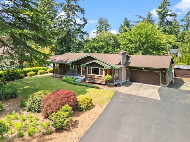 3123 SE 129th Ave, Portland, OR 97236 - view of front of property featuring a chimney, a garage, driveway, a front yard, and roof with shingles