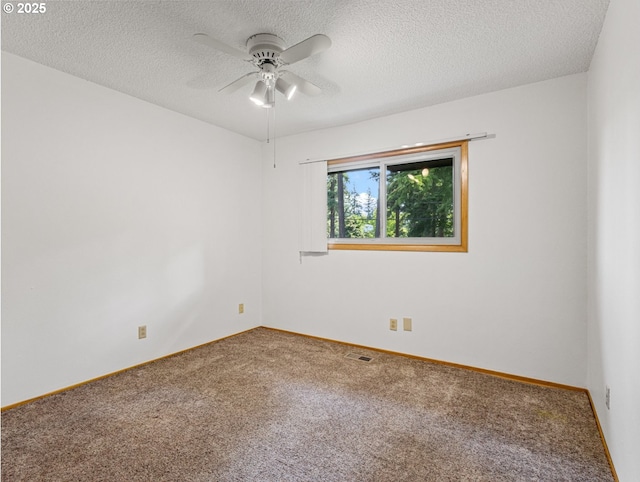 3123 SE 129th Ave, Portland, OR 97236 - spare room with carpet floors, ceiling fan, and a textured ceiling
