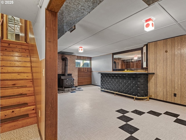 3123 SE 129th Ave, Portland, OR 97236 - indoor dry bar featuring wood walls, a wood stove, stairs, and carpet