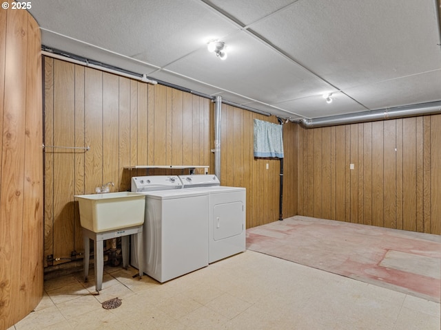 3123 SE 129th Ave, Portland, OR 97236 - laundry room featuring washing machine and clothes dryer, wooden walls, and tile patterned floors
