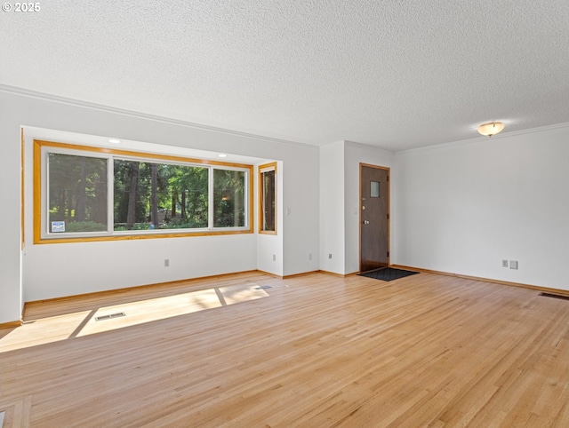3123 SE 129th Ave, Portland, OR 97236 - empty room with wood finished floors and a textured ceiling