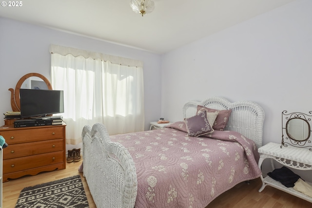 bedroom with light hardwood / wood-style floors